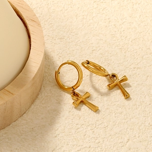Elegant gold Ankh cross stainless steel hoop earrings shown from a 45-degree angle view