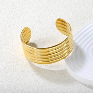 Minimalist 18K gold stainless steel wide cuff bracelet with layered ribbed texture