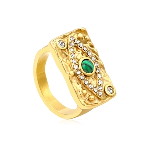 Vintage gold-plated ring featuring green malachite stone and eye-shaped crystal accents