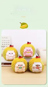 Detail of four cute fruit durian pet figurines including pig and hamster with small flags