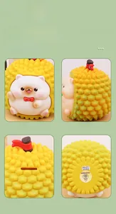 Detail view of durian dog piggy bank showing front, side, coin slot, and base details