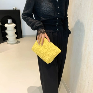 Minimalist lemon yellow pleated floral handbag featuring high-end textured 3D flower quilting