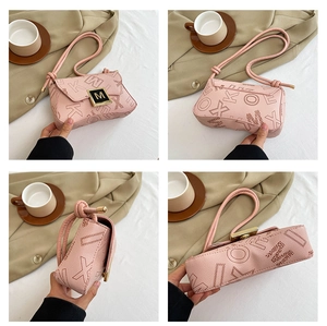 Detail view of pink leather crossbody bag with letter print and gold M-lock buckle