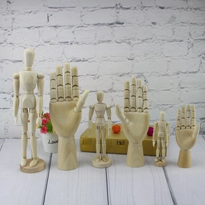 Artistic collection of adjustable wooden mannequins and hand models for drawing and decor