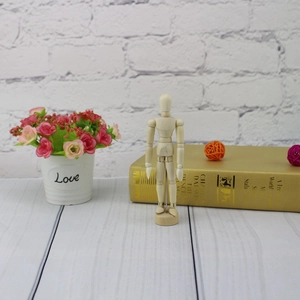 Detailed close-up of a wooden artist mannequin with movable ball joints for drawing poses