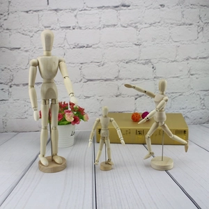 Three wooden artist mannequins in varied sizes with adjustable joints and metal stands