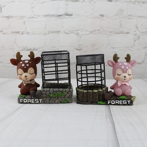 Close-up of cartoon deer pencil holders with forest texture bases and metal mesh frames