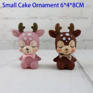 Cute cartoon deer cake toppers in pink and brown, perfect for creative desktop decoration