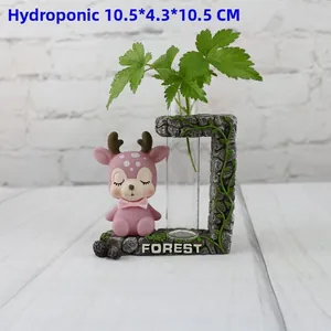 Close-up of pink deer figurine with glass hydroponic test tube vase on stone base