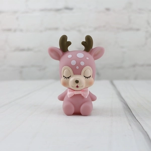 Pink deer figurine with a satin bow, sleeping design for desktop decor or cake topper