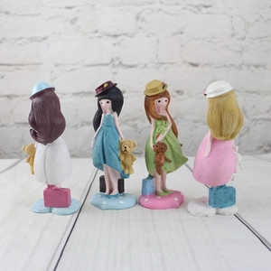 Set of four cute resin girl figurines in colorful outfits with teddy bears for home decor