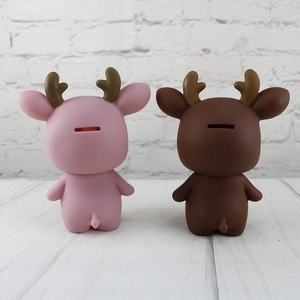 Rear view of pink and brown deer piggy banks showing the rectangular coin slot on the back