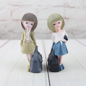 Charming set of two resin girl figurines for home decor and creative desk accessories