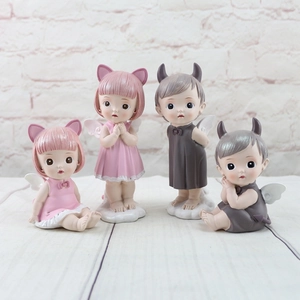 Set of four resin angel ornaments in pink and grey for home decor and cake topper