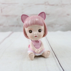 Detailed view of a cute resin girl figurine with pink hair and cat ear headband