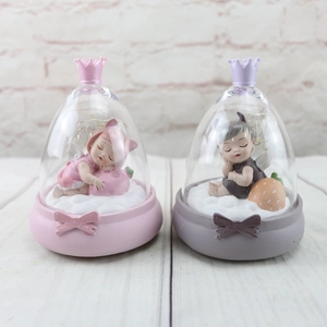 Pink and purple sleeping angel resin ornaments in glass domes with LED lights