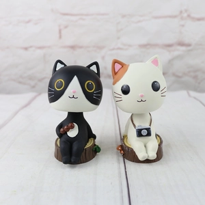 Japanese Zakka style resin cat figurines featuring black white and calico kittens on wood stumps