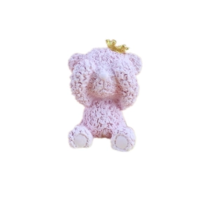 Pink bear ornament with rose petal texture and gold crown in a see-no-evil pose