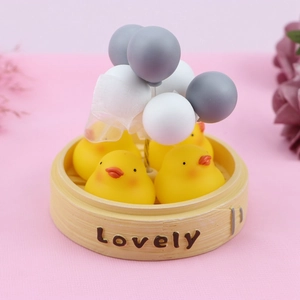 Creative yellow duck miniature in bamboo steamer with balloons for car and desk decor