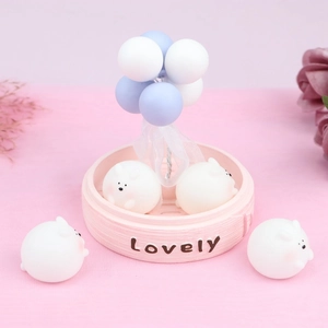 Detail of cute white rabbit figurines with Lovely base and blue balloon decor