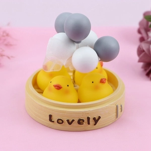 Detail of creative car ornament with yellow ducks in bamboo steamer and balloons