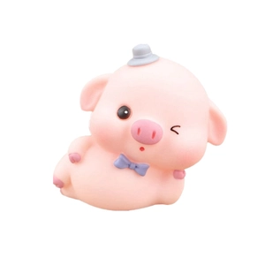 Cute pink pig cake topper with grey top hat and purple bow tie for party decor