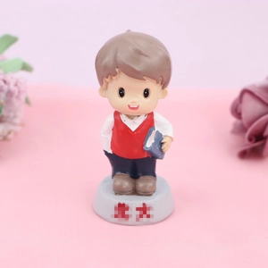 Chinese style boy student figurine cake topper holding a book on Peking University base
