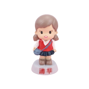 Cute girl figurine cake topper in school uniform for creative birthday party decoration