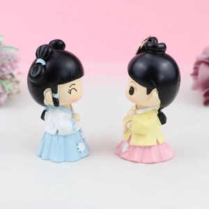 Pair of cute resin Chinese princess cake toppers in traditional hanfu style outfits