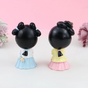Rear view of two cute cartoon girls in traditional Hanfu attire for cake decoration
