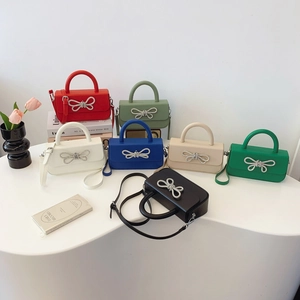 Fashionable mini square bags with rhinestone bow buckles in seven elegant colors