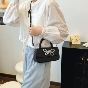 Chic black box handbag with silver rhinestone bow and adjustable shoulder strap