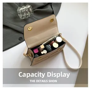 Detailed interior view showing daily essentials storage in the light beige flap crossbody bag
