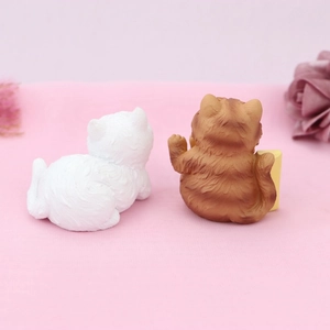 Detailed view of two cute resin cat figurines with hair-like texture for car decor
