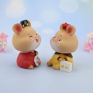 Detail of cute resin zodiac rat car ornaments with Chinese traditional festive outfits