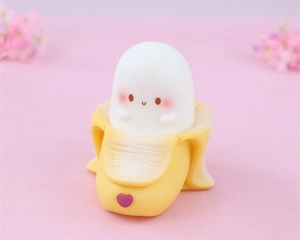 Close-up of cute banana ghost night light with heart detail for kids bedroom