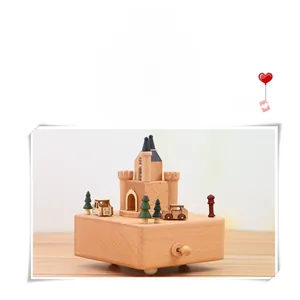 Macro shot of handcrafted beech wood music box featuring a castle and rotating knob