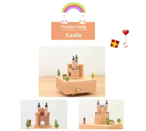 Detailed view of handmade wooden castle music box with intricate miniature scenery