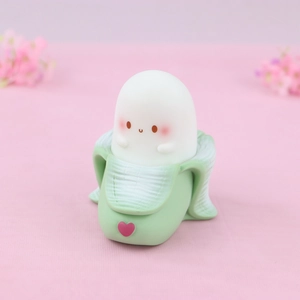 Cute banana ghost night light for bedroom with warm glow and soft silicone finish
