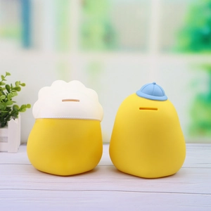 Set of two cute yellow duck piggy banks with hat details for kids bedroom decor