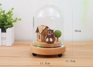 Detailed view of the 16cm height and 11.5cm width of the wooden music box glass dome