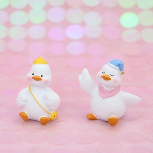 Cute duck resin figurines set for car dashboard and desk decor with dreamy pink background