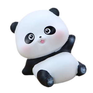 Cute cartoon panda figurine for cake decoration or car dashboard ornament in side-sitting pose
