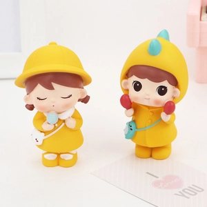 Cute cartoon couple figurines in dinosaur hood and yellow hat for car or cake decoration