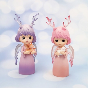 Close-up of cute dream angel figurines with pastel gradient finish for car or home decor