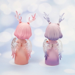 Rear view of two creative deer angel resin figures with small wings in soft pink tones