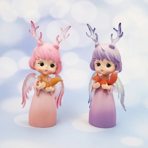 Close-up of cute dream angel deer girl resin ornaments in pink and purple colors