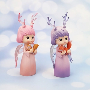 Detailed view of dream angel ornaments with translucent wings and small fox figurines