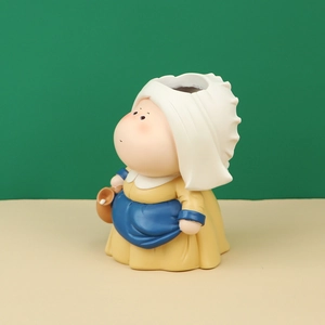 Artistic resin desk organizer showing a creative figurine inspired by The Milkmaid painting
