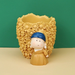 Detail of sunflower embossed texture and cartoon pearl earring girl resin holder